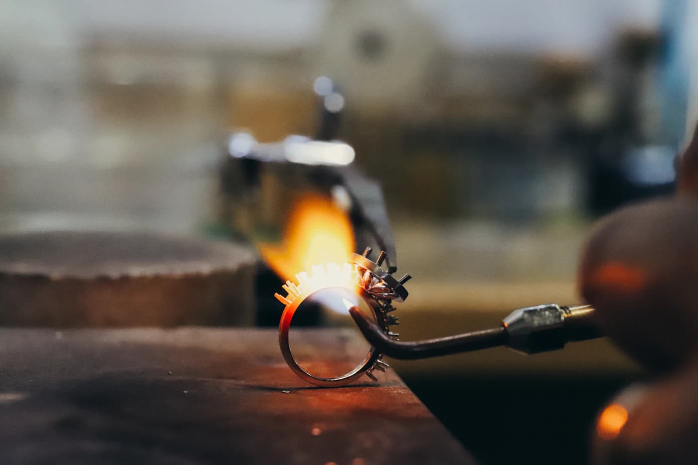 A ring being worked with a jeweller's torch